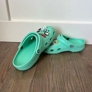 Teal crocs with jibbitz